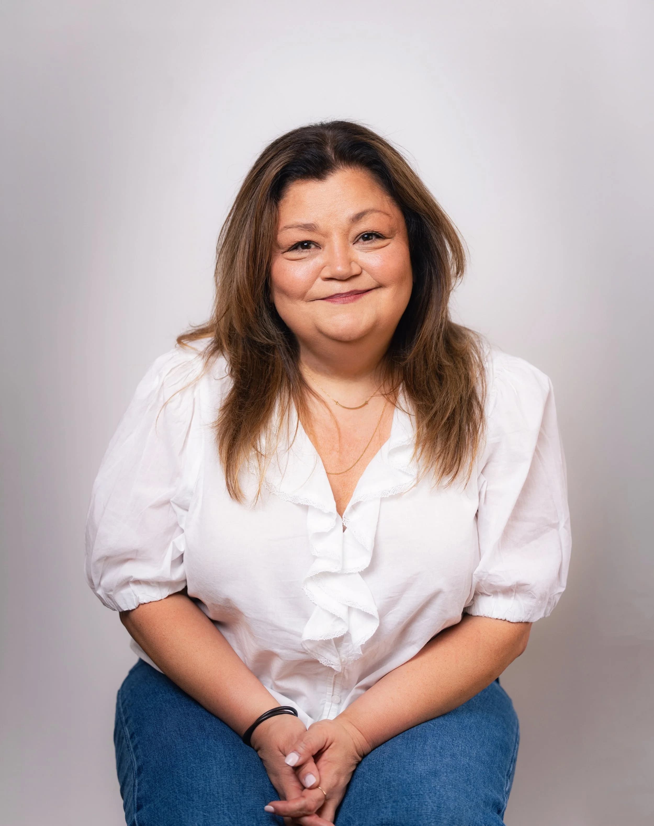 Elsa Carrasco seated for a portrait